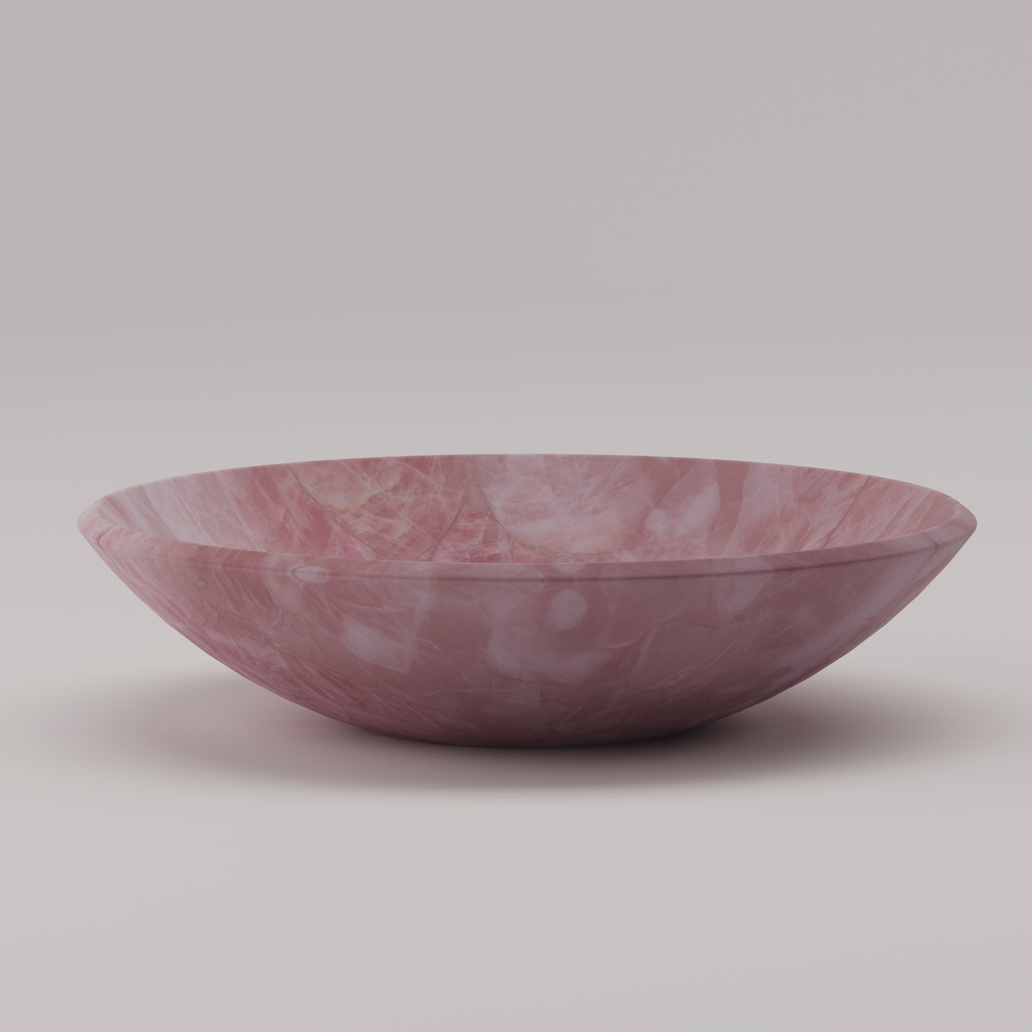 Luxury round sink handcrafted from Pink Quartz semi-precious stone — ideal for high-end vanities and designer bathrooms by Pierre Mason
